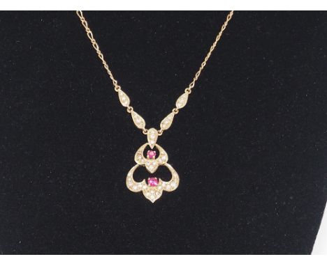 A Victorian 9ct yellow gold diamond and ruby necklace, it is 16 inches in length, apprix weight 4.5grams,in great condition