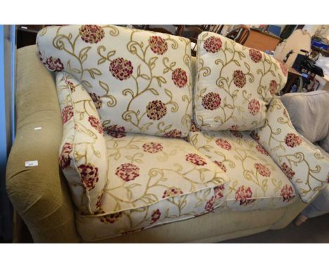 A floral upholstered two seater sofa