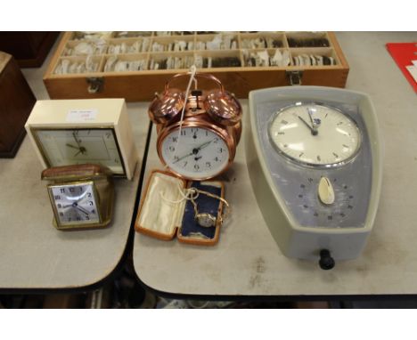 Coin operated alarm clock, ladies gold watch, travel clock and other clocks