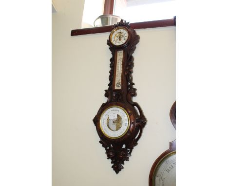 19th Century French walnut barometer, clock and thermometer by Bourgeois, Paris, contained in carved case