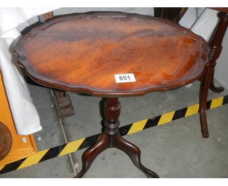 A clean mid 20th century mahogany tripod table.