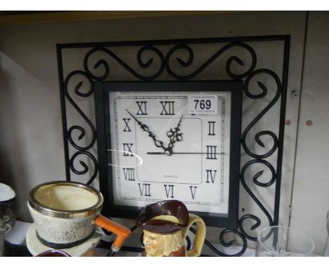 A metal wall clock.