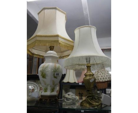 A floral ceramic table lamp and one other.