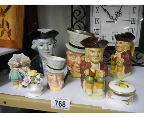 A mixed lot including Toby jugs, trinket box etc.,