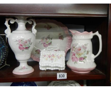 A small jug and basin set and a vase.