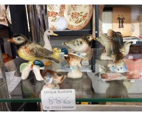 A quantity of ceramic birds.&nbsp;