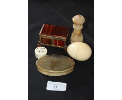 19th Century horn oval snuff box, crudely engraved to lid with a ship, an antique ivory sewing egg, a vegtable ivory needle c