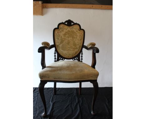 Edwardian mahogany armchair upholstered in old gold chenille, the back with machined tapestry of courting couple