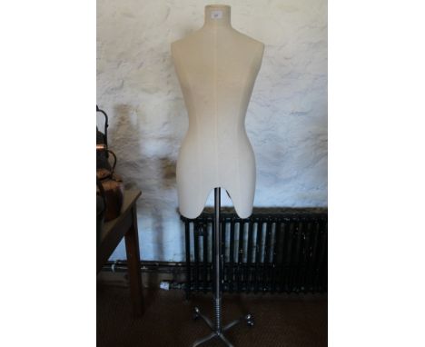 Vintage tailor's dummy on polished steel base with castors