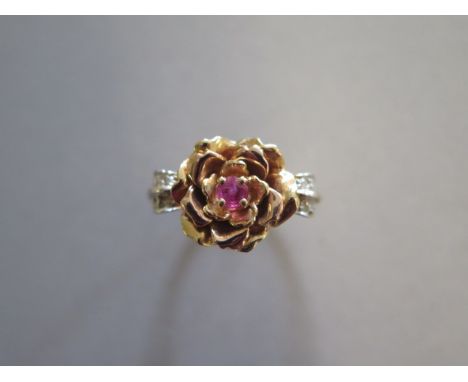 A hallmarked Elizabeth of Glamis Rose ring, a jewelled ring crafted of 2 shades of 14ct gold set with 8 sparkling diamonds an