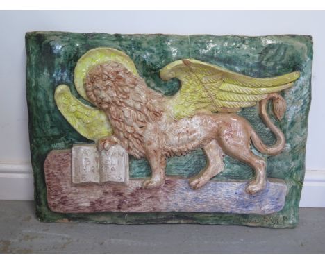 A terracotta plaque of the Lion of St Mark symbol of Venice, 50cm x 70cm, this has been broken and repaired with some chippin