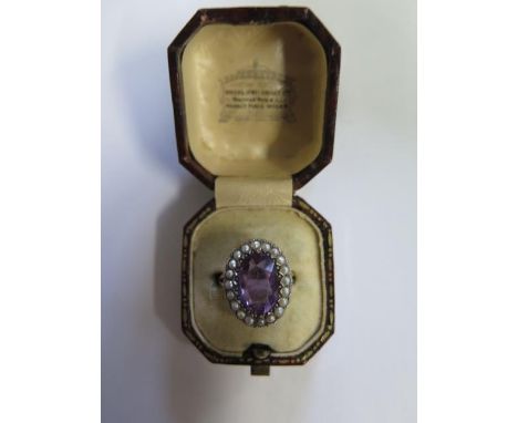 A 9ct yellow gold amethyst and pearl ring, size N, head approx 2cm x 1.5cm, approx 6 grams, generally good, possible old repa