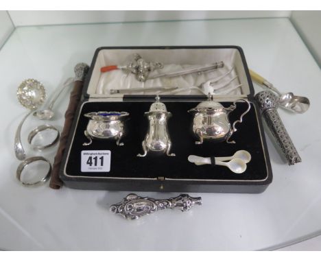 A silver cruet set boxed- missing one insert, and associated silver flatware handles, 2 pencils, a GU rattle and a plated for