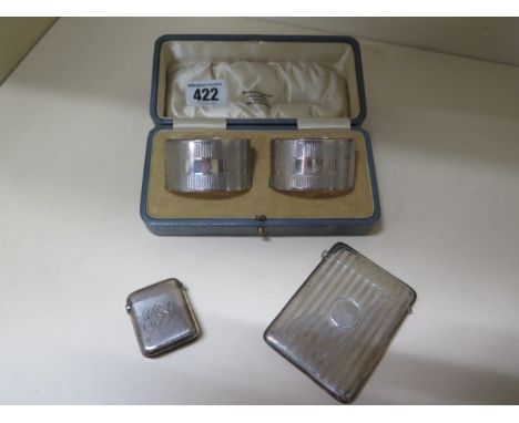 A silver card case, a pair of silver napkin rings boxed, and a silver vesta, total approx 5.9 troy oz, serviette rings engrav