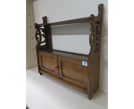 An oak wall shelf with cupboard in polished condition, with key, 54cm tall x 53cm x 14cm 