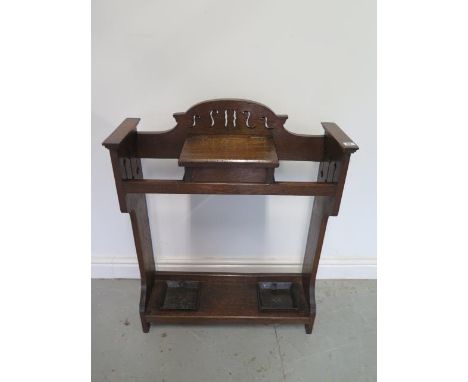 An oak Arts and Crafts stick stand, 90cm tall x 72cm x 24cm 