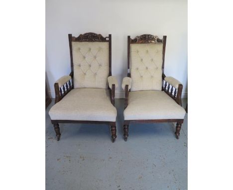 A pair of late Victorian reupholstered button back open armchairs, 103cm tall x 66cm wide x 67cm 