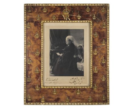 *Victoria (Queen of England, 1819-1901). Half-tone photographic portrait of Queen Victoria seated with letter in hand, 1899, 