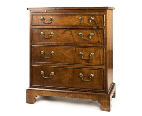 *Chest. Georgian style mahogany bachelor's chest,  with brushing slide above three drawers, each with brass handles on bracke