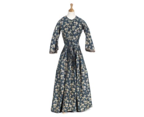 *Dress. A damask gown, circa 1840s,  hand-sewn dress of damask with woven silver rose sprays on a dusky blue ground, fitted b