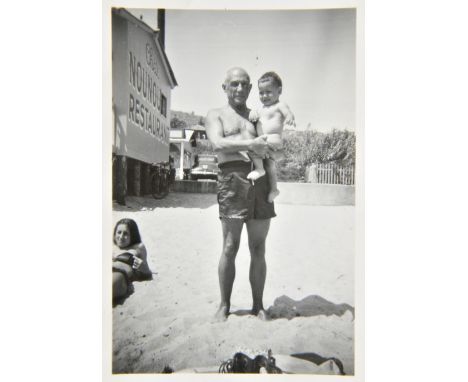*Picasso (Pablo, 1881-1973). Group of four original photographs of Picasso with friends and family at the beach, taken by the