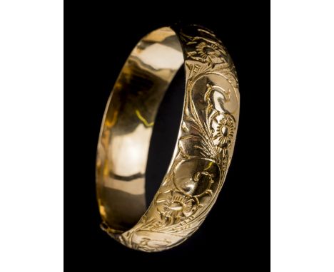 *Bangle. 14K gold bangle,  engraved with floral design, stamped 14K, approximately 22g  (1)