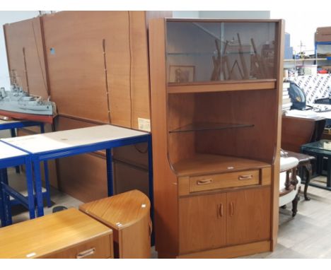 A TEAK CORNER UNIT BY G-PLAN GLAZED SLIDING DOORS ABOVE GLASS SHELF WITH CUPBOARD BELOW 105 X 170 X 77CM APPROX