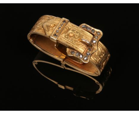 A Walton's flexible 15 carat gold scarf clip formed as a belt with buckle and set with rose cut diamonds, 5.5 grams gross wei