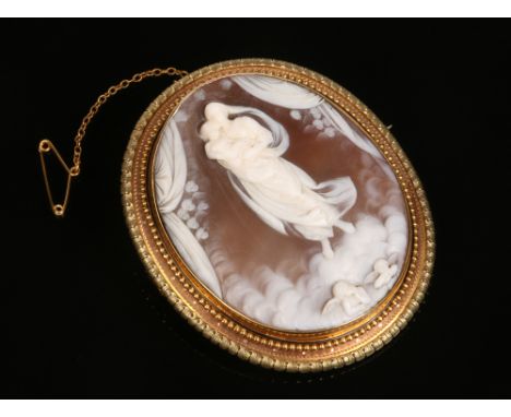 A fine quality early Victorian yellow metal mounted large shell cameo brooch. Carved to depict the Sistine Madonna after Raph