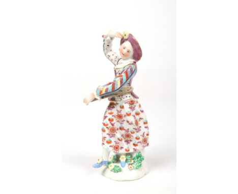 A rare Bow commedia dell'arte figure of Harlequin's companion Columbine. Modelled in a dancing pose holding a slapstick, her 