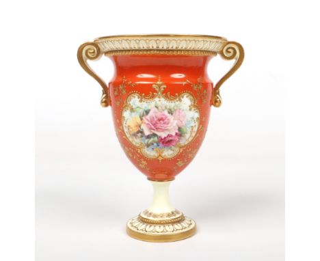 A Royal Worcester twin handled pedestal vase by Harry Chair. Ground in burnt orange, with raised gilding and painted with ros