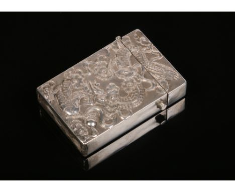 A Chinese silver vesta case. Decorated to one side with a dragon chasing a flaming pearl and with prunus blossom to the other