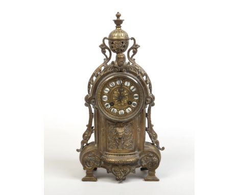 A 19th century French brass cased 8 day boudoir clock. With enamelled Roman numeral markers and housing a cylinder movement s