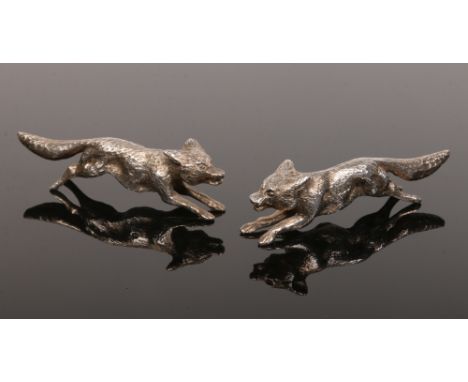 A pair of George V cast silver models of running foxes by William Hutton &amp; Sons Ltd. Assayed Sheffield 1925, 114 grams, 9