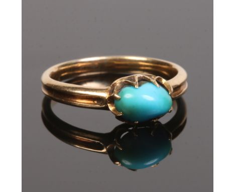 A 19th century gold and turquoise ring with reeded shank and claw set in medieval style, size M.