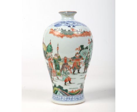 A Chinese famille verte meiping vase. Painted with an underglaze blue lambrequin collar and with a procession of figures in c