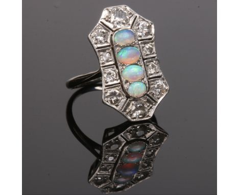 An Art Deco platinum panel ring. Set with four ovoid opals under a border of ten old European cut diamonds, the panel is pier