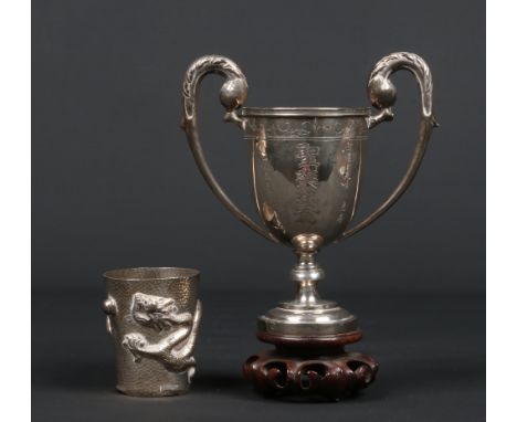 An early 20th century Chinese silver twin handled trophy with inscription and raised on hardwood plinth along with a small Ch