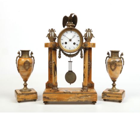 A 19th century French sienna marble and gilt metal Neo-Classical clock garniture surmounted by an eagle and lyre finials and 