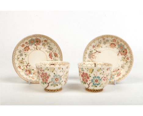 A pair of 19th century Aesthetic movement breakfast cups and saucers, possibly Zsolnay.&nbsp; decorated in coloured enamels w