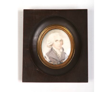 A 19th century framed ivory portrait miniature of a gentleman wearing a cravat, 6.25cm x 5cm.