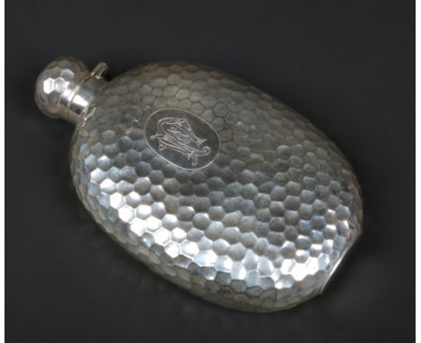 A Victorian hammered silver hip flask. Engraved with a P. W. monogram. Assayed Birmingham 1892, 236 grams, 16.75cm.Condition 