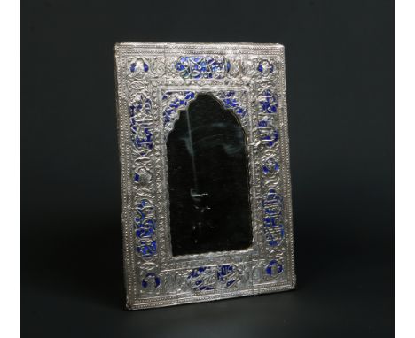 A 19th century Middle Eastern silver mounted mirror. Ground with blue enamel and decorated with Qoranic script and portraits 