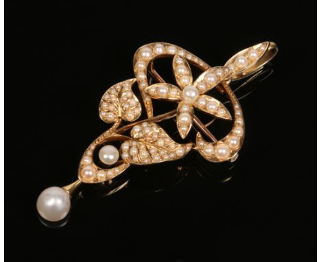 A 15 carat gold spray brooch / pendant. Set with seed pearls and with a single pearl drop, 9.2 grams, 57mm including the bale