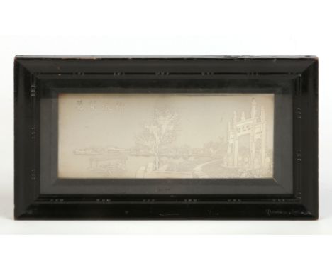 An early 20th century Chinese silver plaque in ebonized strut frame. Depicting a river scene with a ceremonial archway. Chara
