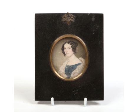 A 19th century ivory portrait miniature in ebonized frame. A maiden with ringlets wearing a shawl and blue dress, 7cm x 6cm.C