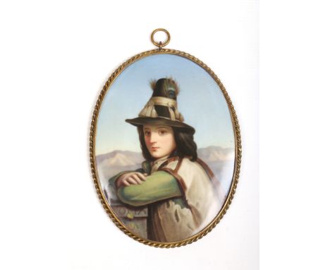 A 19th century Continental porcelain oval plaque, possibly KPM, in brass ropetwist frame. Portrait of a young Tyrolean boy in