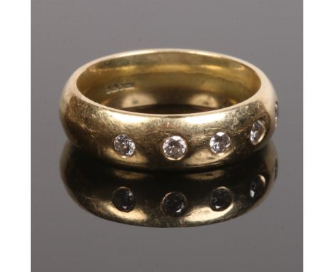 A gentleman's 18 carat gold wedding band rub over set with five diamonds, approximately 0.25ct combined, 12.3 grams, size Q.C