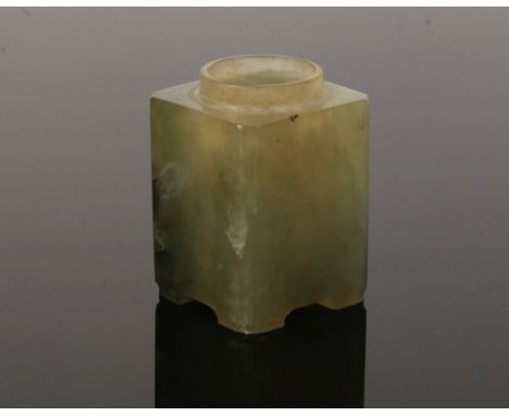 A Chinese miniature pale green jade square vessel of archaistic form. With reeded corners and raised on bracket feet, 5cm.Con