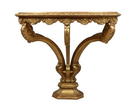 A Regency marble top giltwood console table. With fleur de lys and gardroon moulding and raised on four acanthus scrolls over